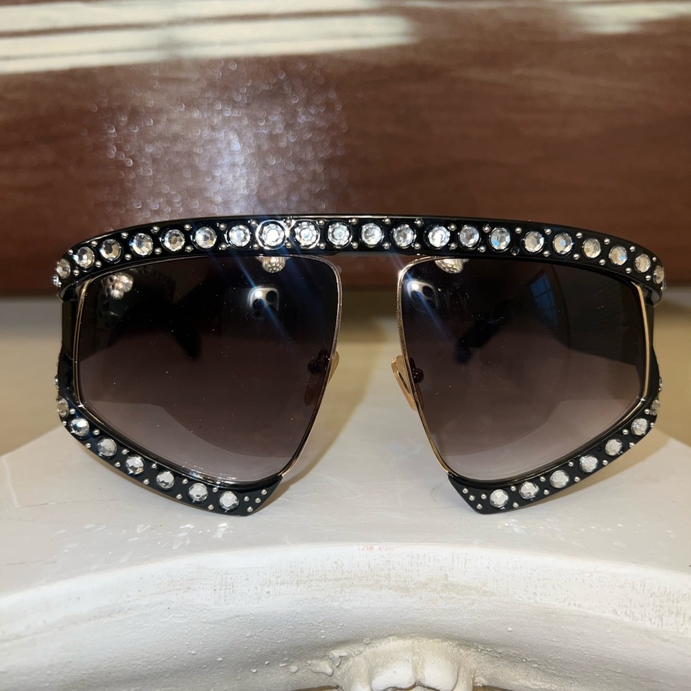 A vibrant sunglasses with rhinestone embellishment
